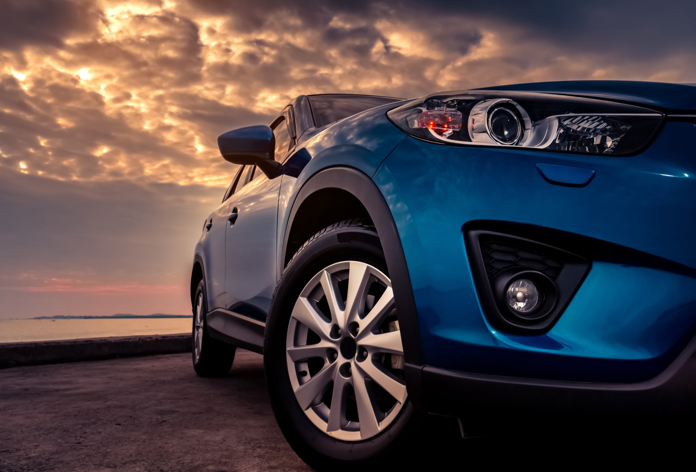 Blue SUV Car at Sunset 